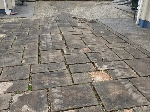 Old damaged patio paving in Athenry before being repaired